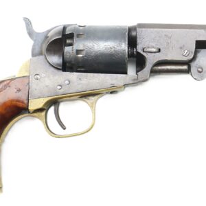 A vintage revolver with a wooden grip, brass trigger guard, and blued metal barrel and cylinder, displayed on a white background.