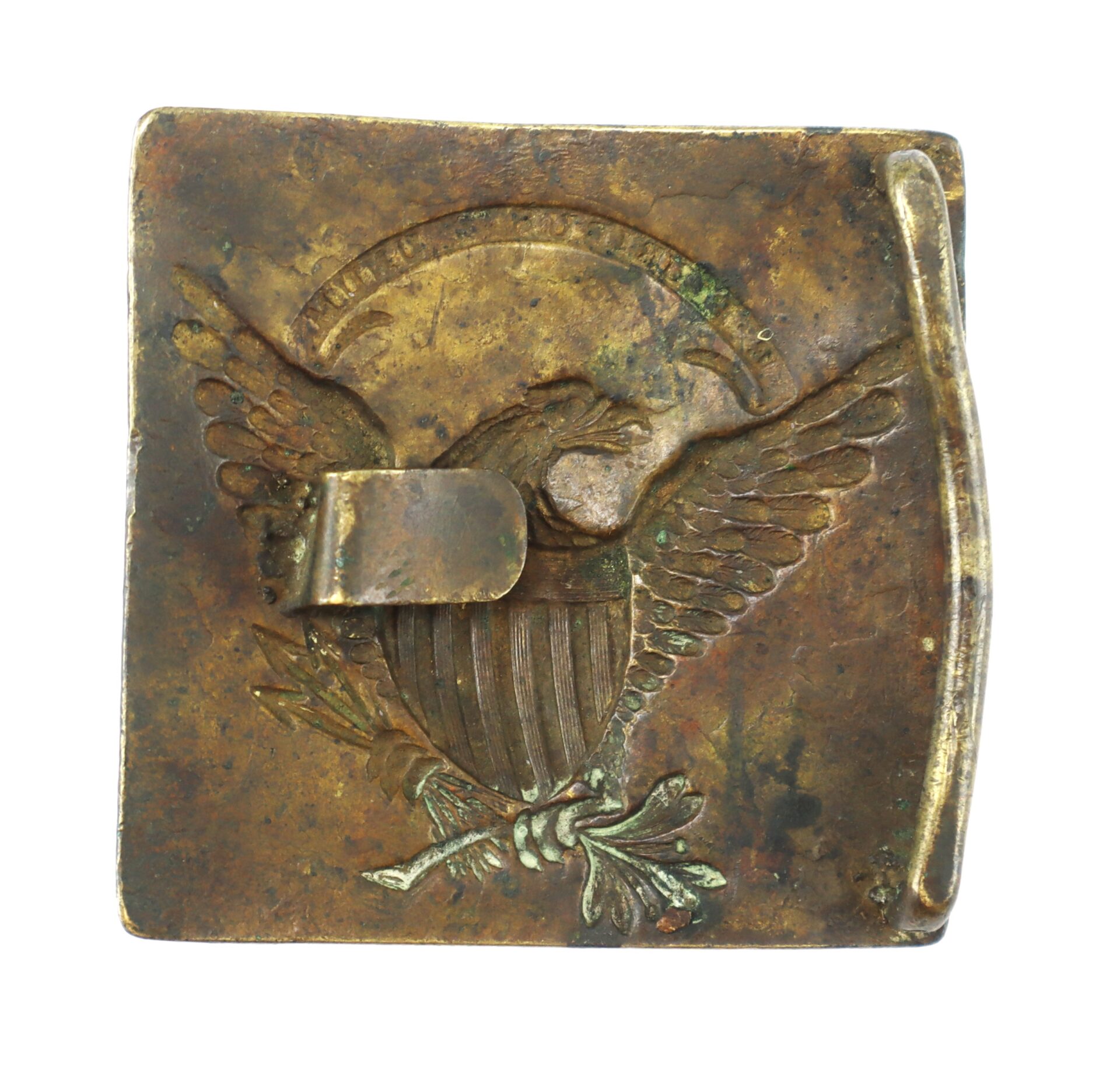 A tarnished brass belt buckle featuring an eagle with outstretched wings, holding arrows and an olive branch, and a rectangular hook on the right side.