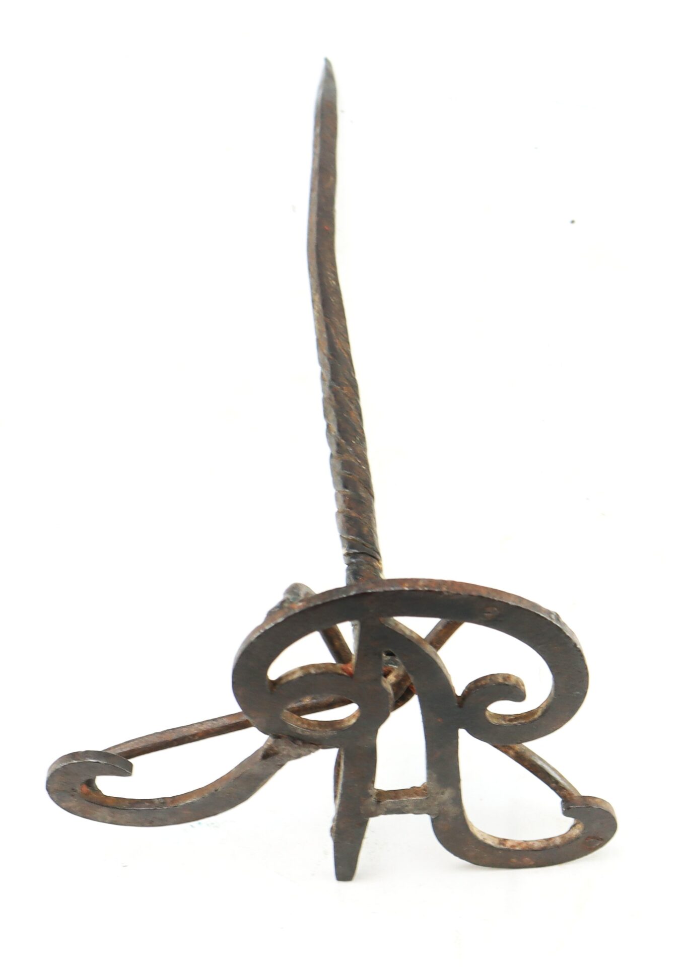 A wrought iron branding iron with a long handle and ornate scroll design at the base, positioned upright on a white background.