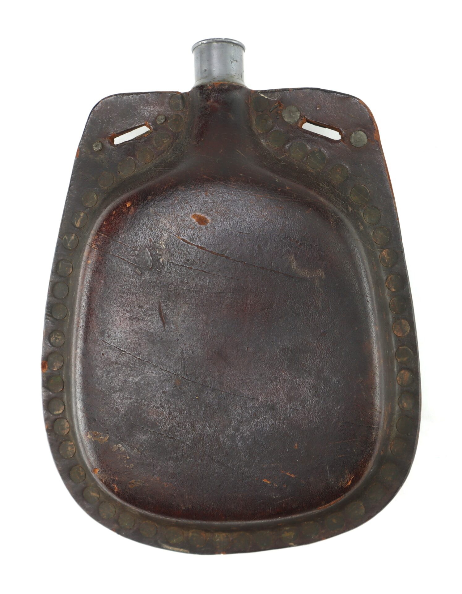 A vintage brown leather canteen with a metal spout and reinforced edges, showing signs of wear and age.