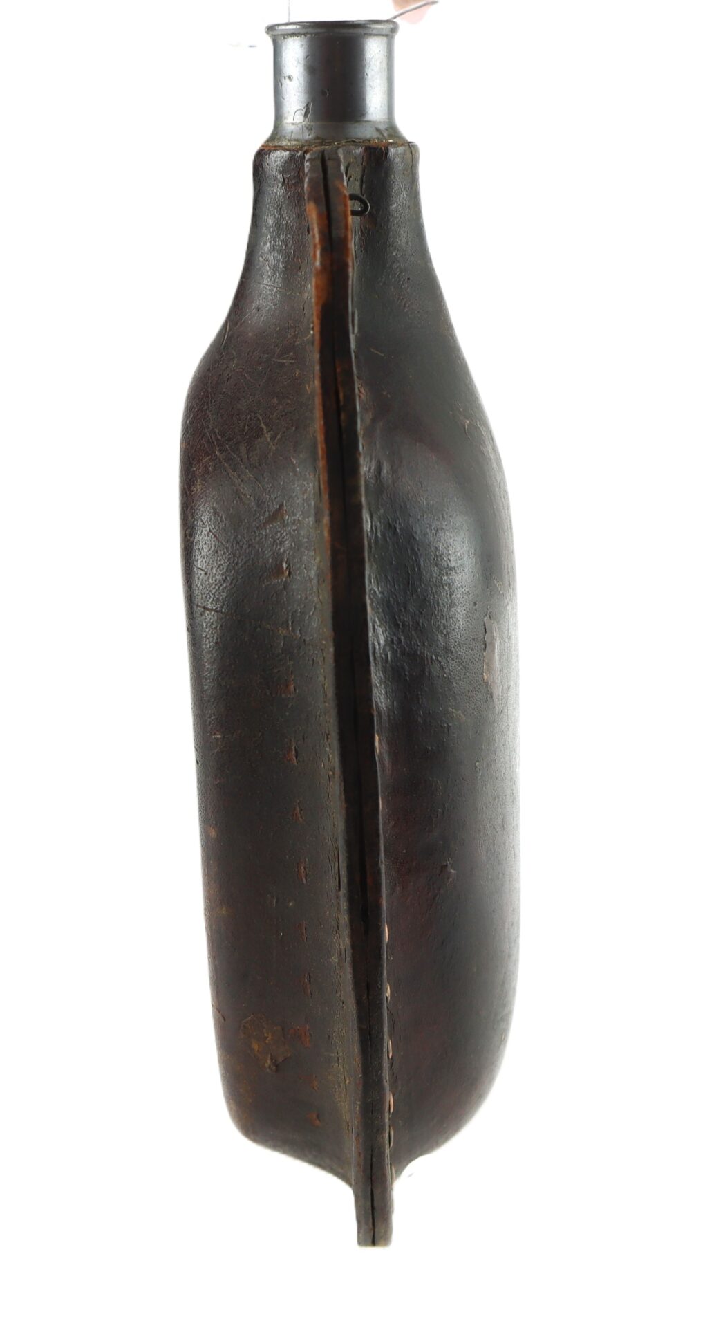 A worn, vintage canteen with a stitched leather cover and a metal neck, viewed from the side.