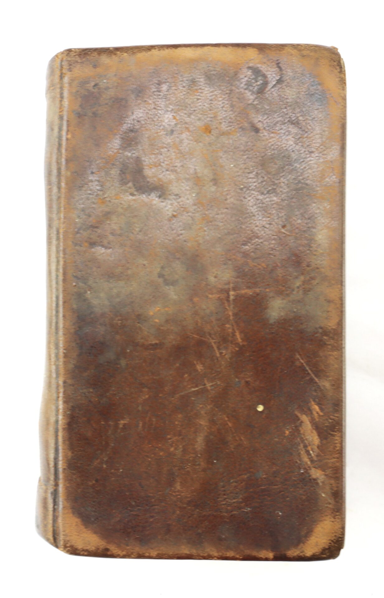 A worn Confederate Bible with a brown leather-bound, scuffed cover and rounded spine, showing signs of age and use.