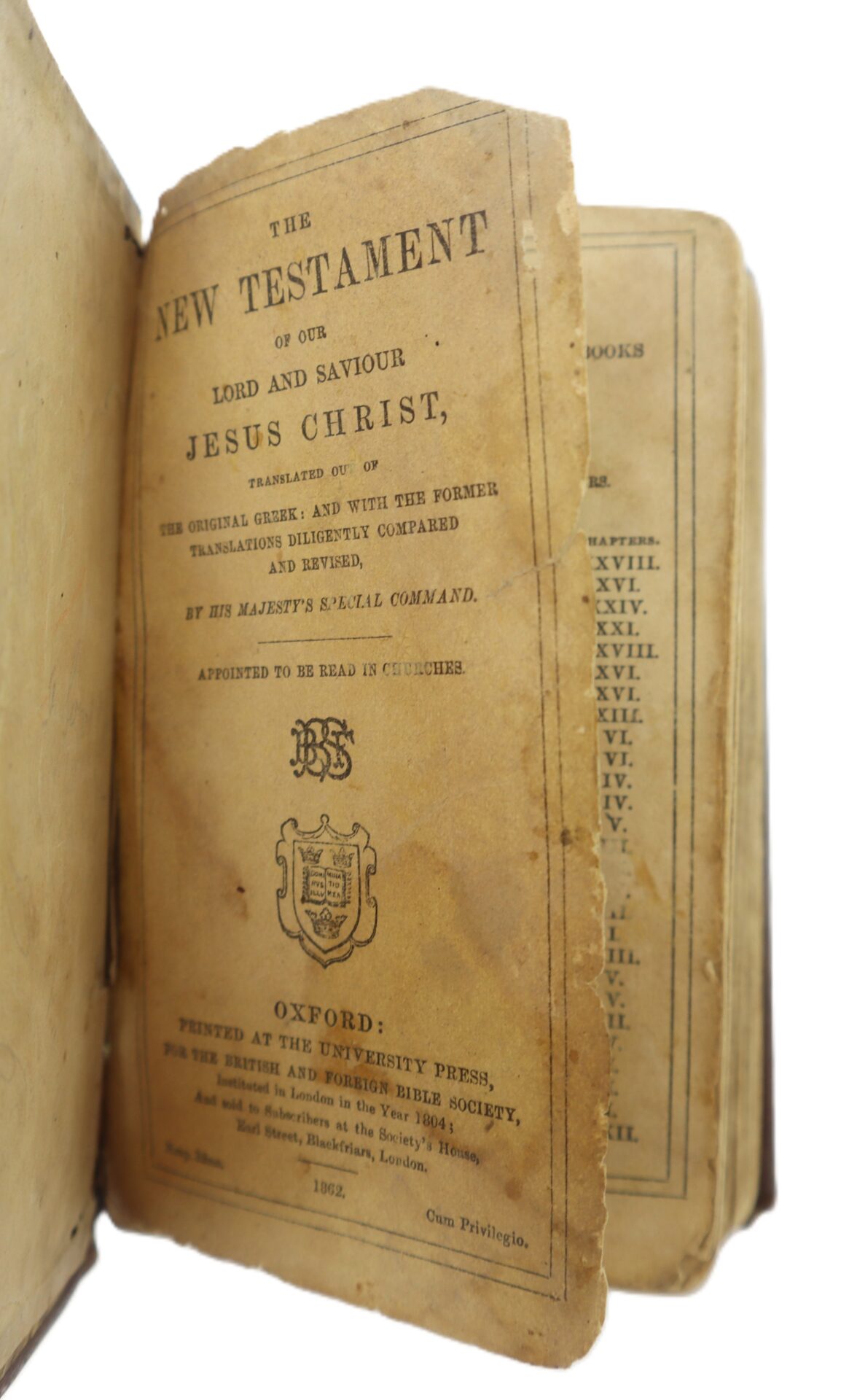 A worn, yellowed Confederate Bible, opened to the title page, printed at Oxford in 1862, with visibly aged and torn pages.