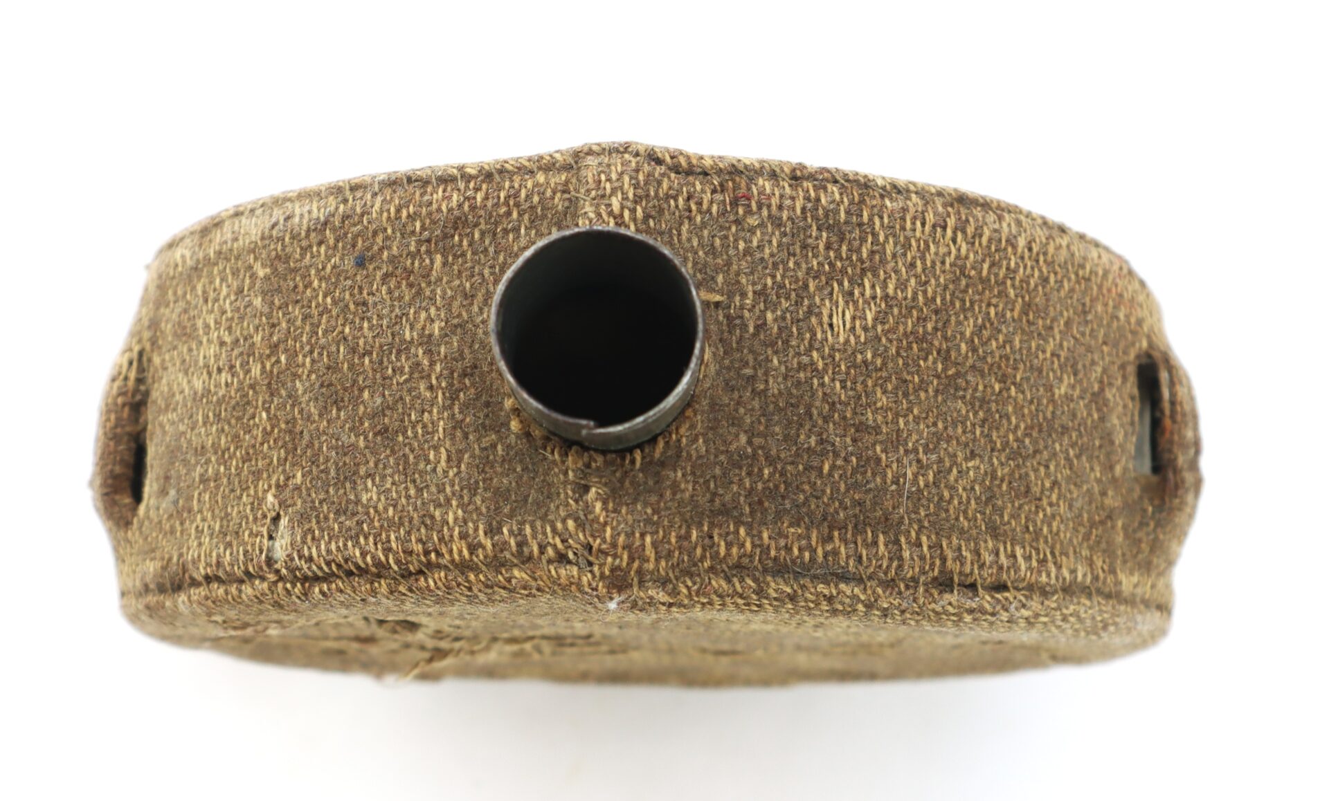 A close-up view of a vintage canteen with a fabric cover, showing the open mouth and textured stitching details.