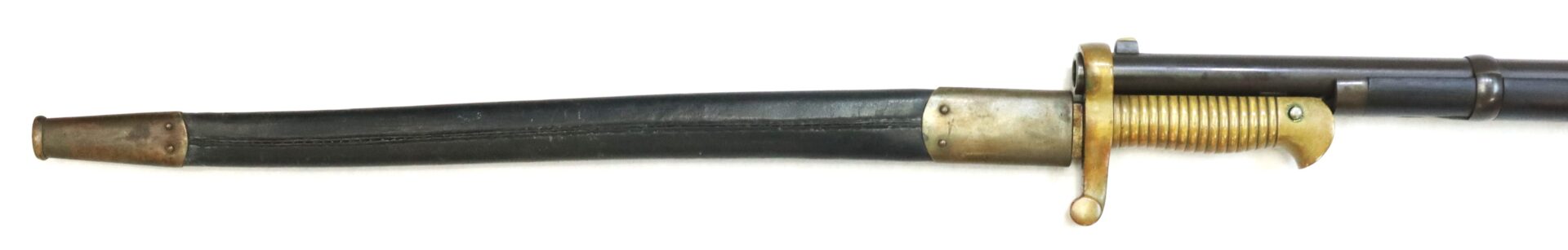 A vintage rifle with a brass-handled bayonet attached; the bayonet is partially sheathed in a black scabbard with a metal tip.