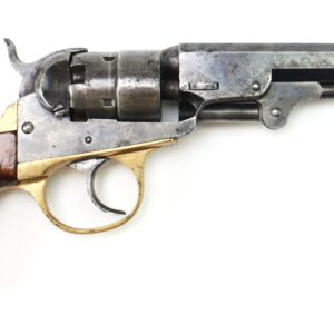 A vintage revolver with a wooden grip, brass trigger guard, and metal barrel, displayed on a white background.