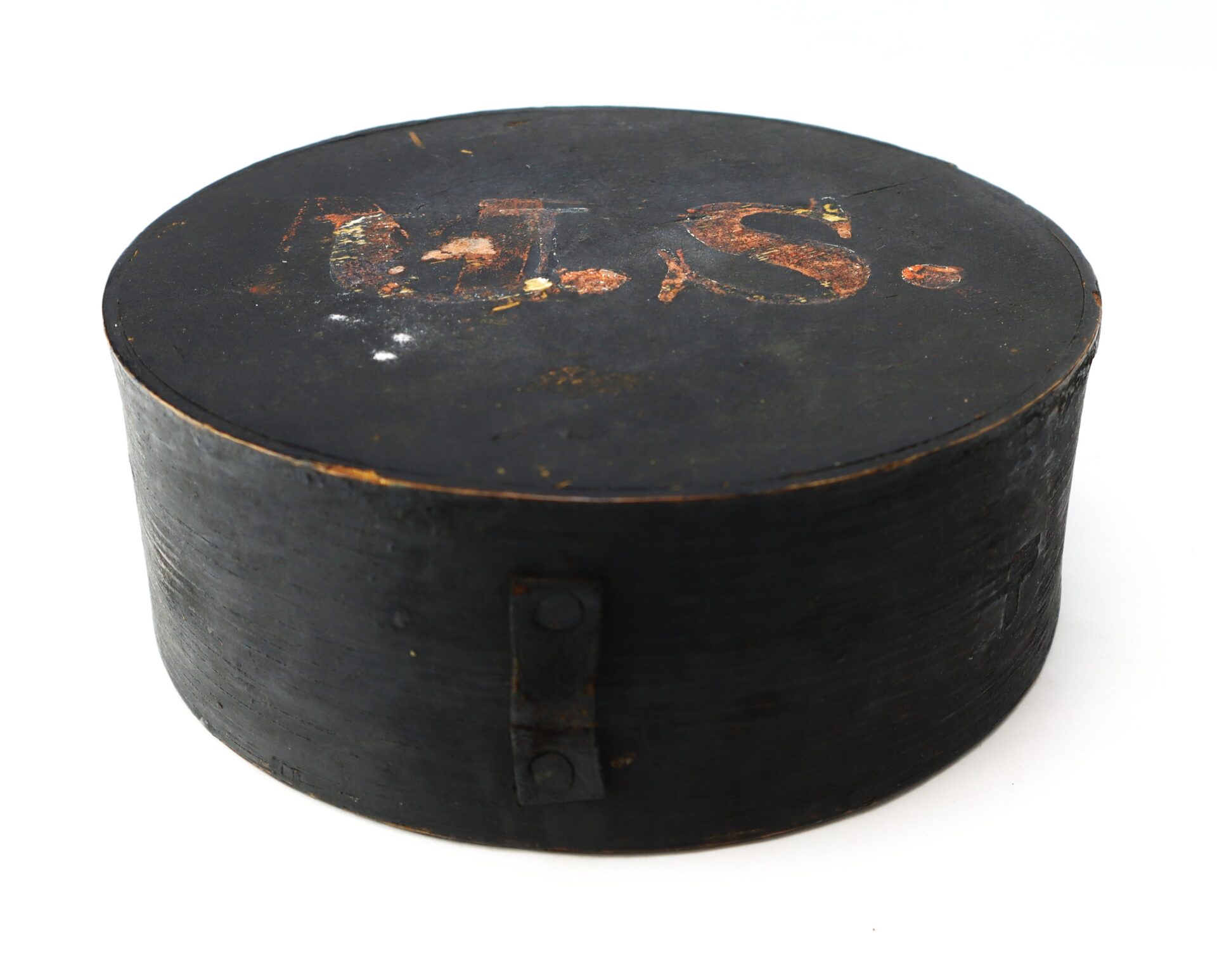 A round, black wooden Mexican War Cheesebox Canteen with faded "A.H.S." on the lid and a simple metal hinge on the side.