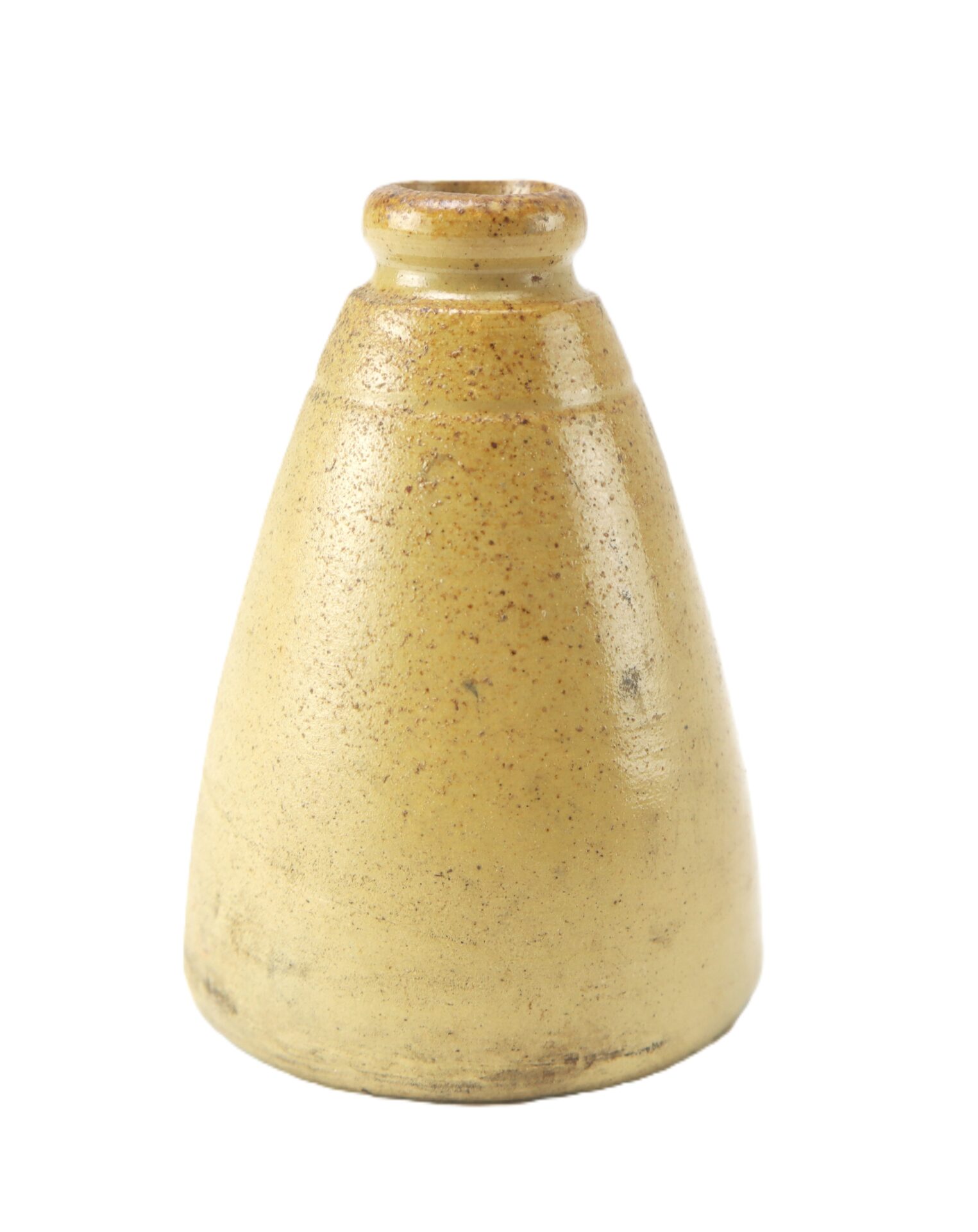 A small, cone-shaped, beige ceramic object with a narrow top and wider base, set against a white background.