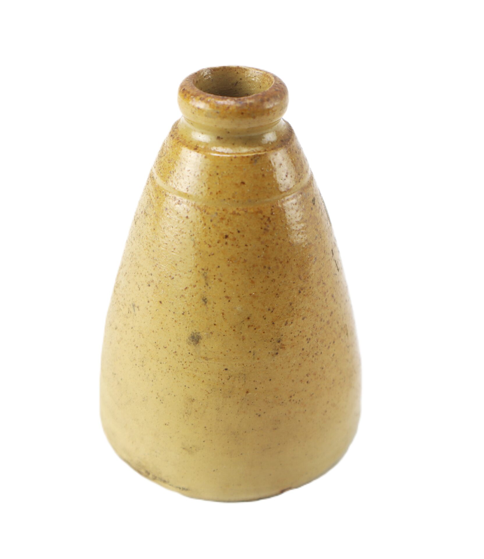 A small, conical, yellowish-brown ceramic bottle or vessel with a narrow opening at the top.