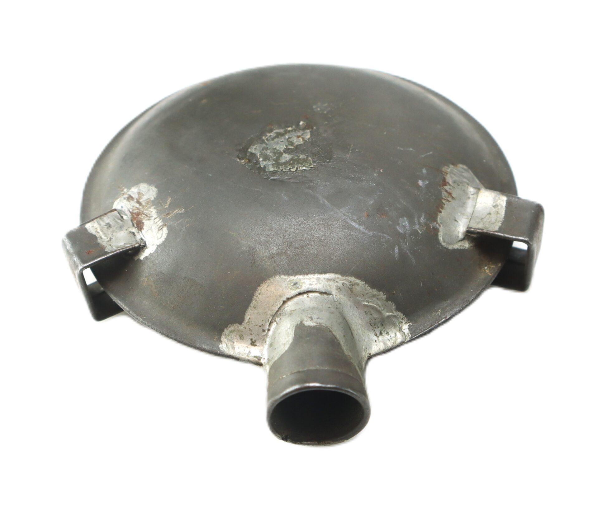 A round metal object with a central spout and two side brackets, showing signs of wear and welding marks.