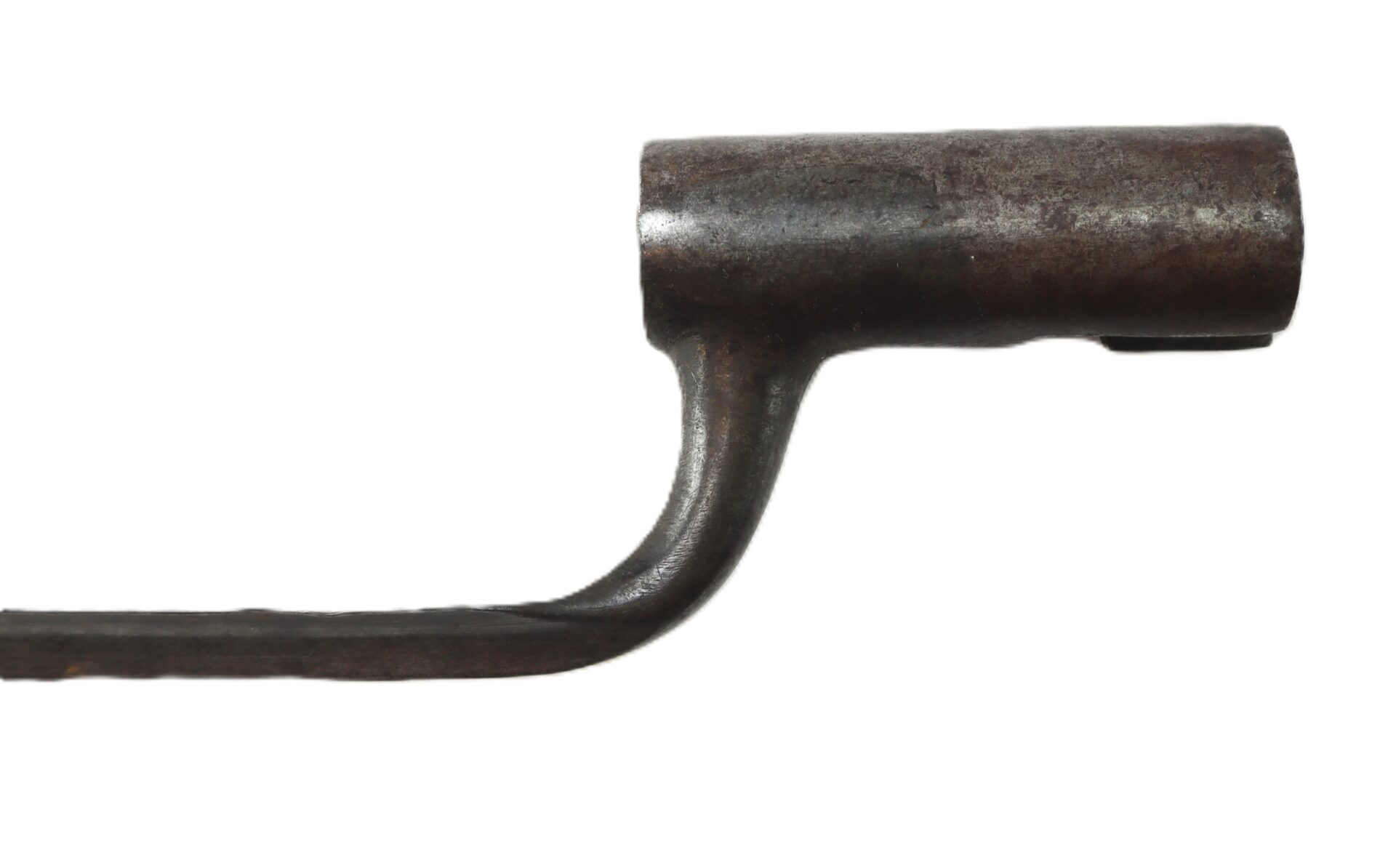 A close-up of a rusted, L-shaped metal tool with a cylindrical socket on one end, set against a white background.