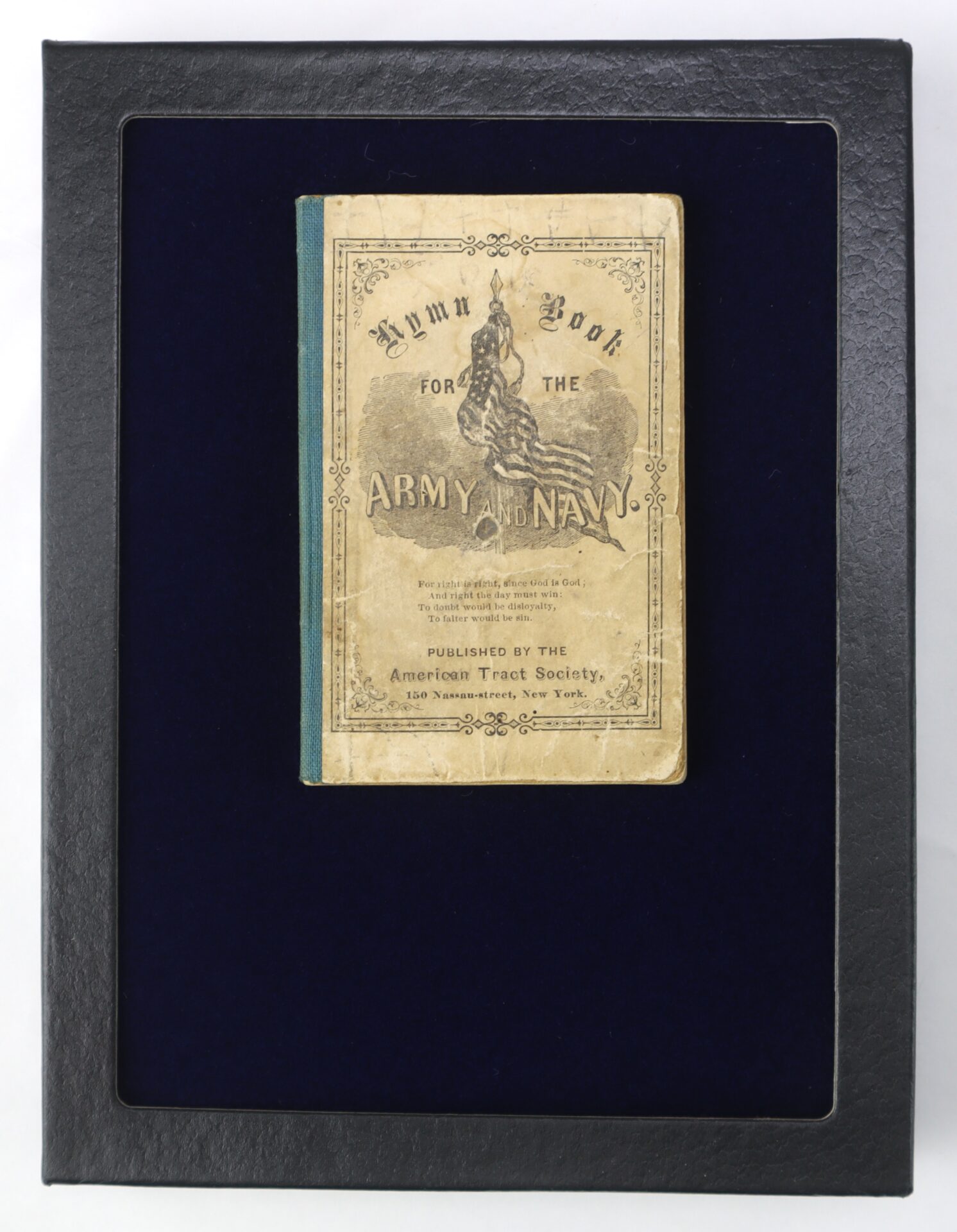 A vintage book titled "Hymn Book for the Army and Navy" is displayed in a black frame with a blue background.