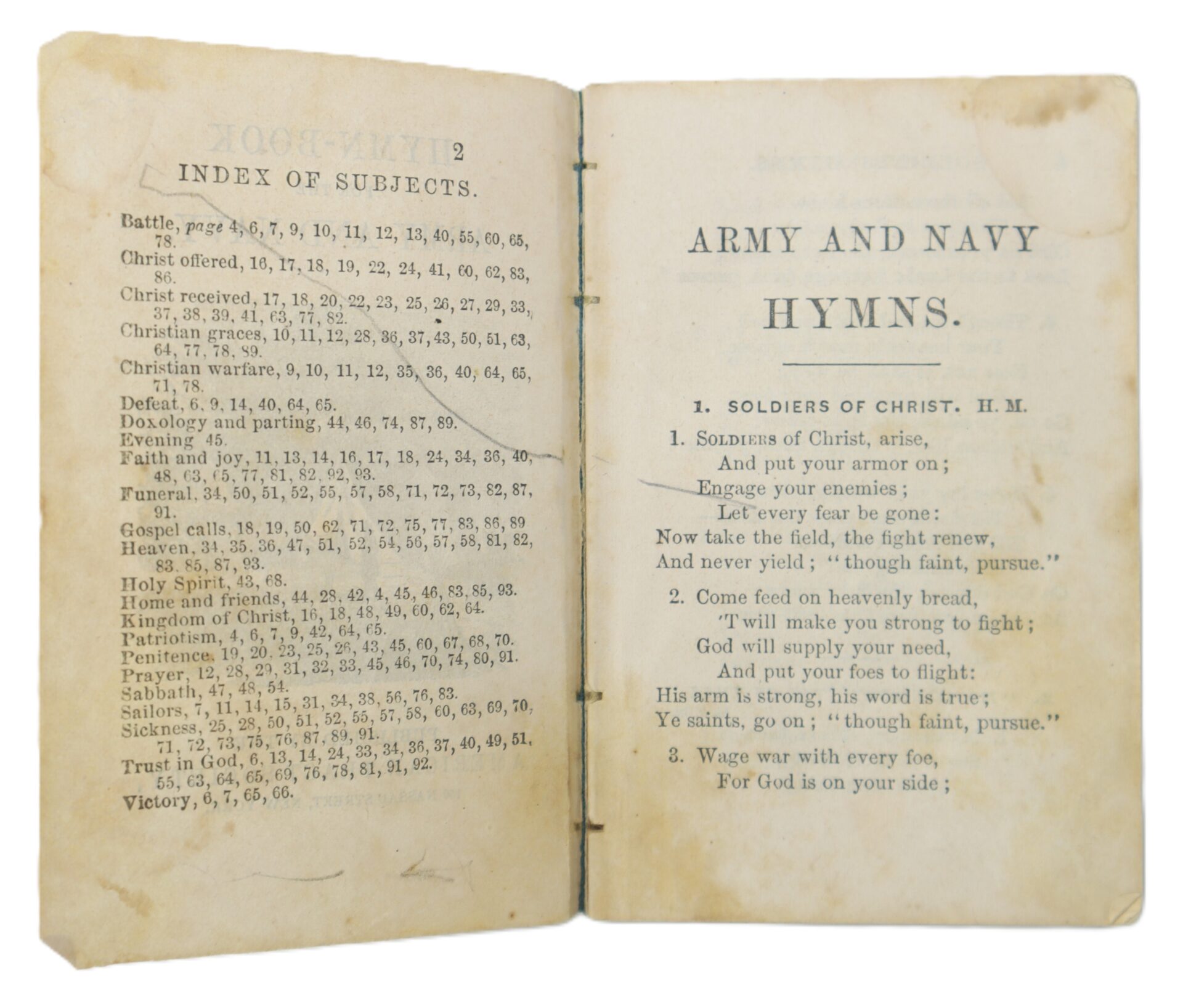 An open vintage hymnal displays an index of subjects on the left and the title "Army and Navy Hymns" with the hymn "Soldiers of Christ" on the right page.