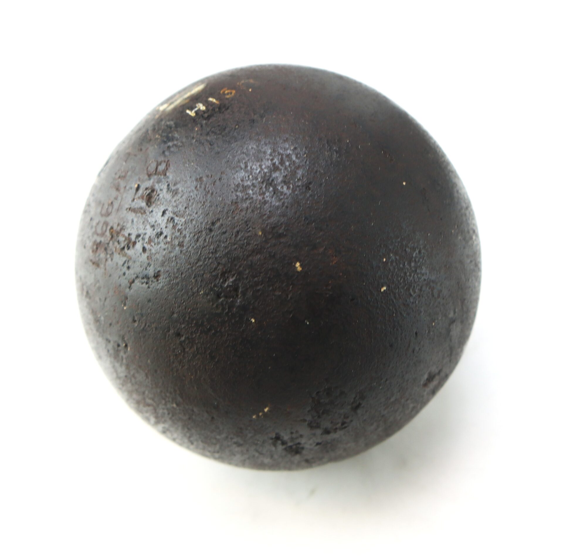 A Confederate Civil War 6-pounder solid shot cannonball recovered from Bull Run, dark and round with a textured surface, displayed on a white background.
