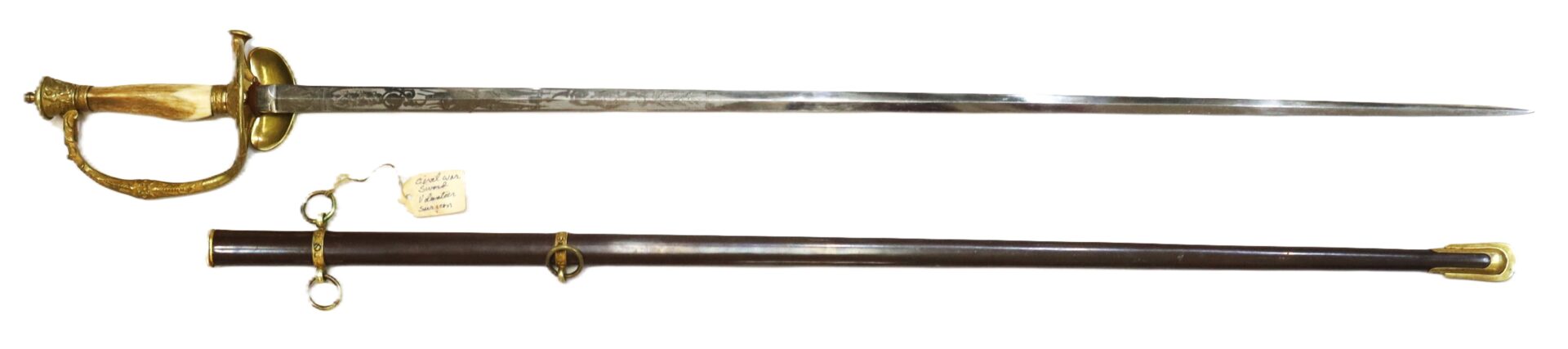 A long, ornate sword with an engraved blade and decorative hilt, displayed above its matching scabbard with brass fittings and rings.