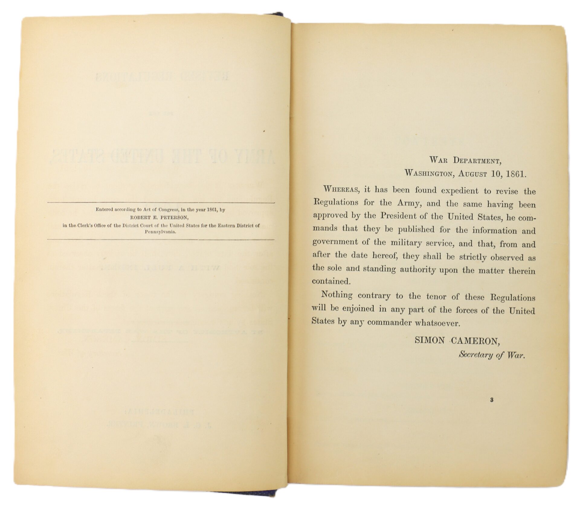 Open book showing a proclamation by the U.S. War Department dated August 10, 1861, regarding revised Army regulations, signed by Secretary of War Simon Cameron.