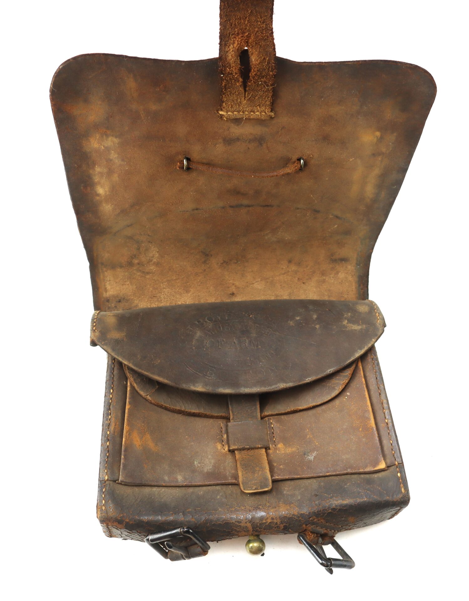 An open, worn brown leather satchel with a front flap, buckles, and visible scuff marks, showing its aged condition.