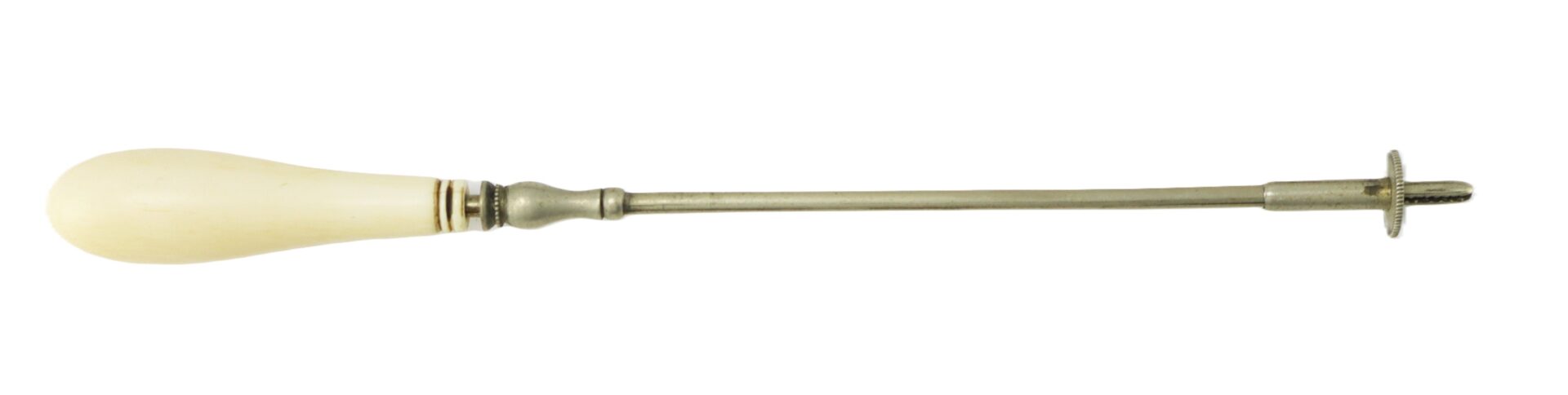 A vintage surgical tool with an ivory-colored handle, a long metal shaft, and a threaded, wheel-like tip on the end.