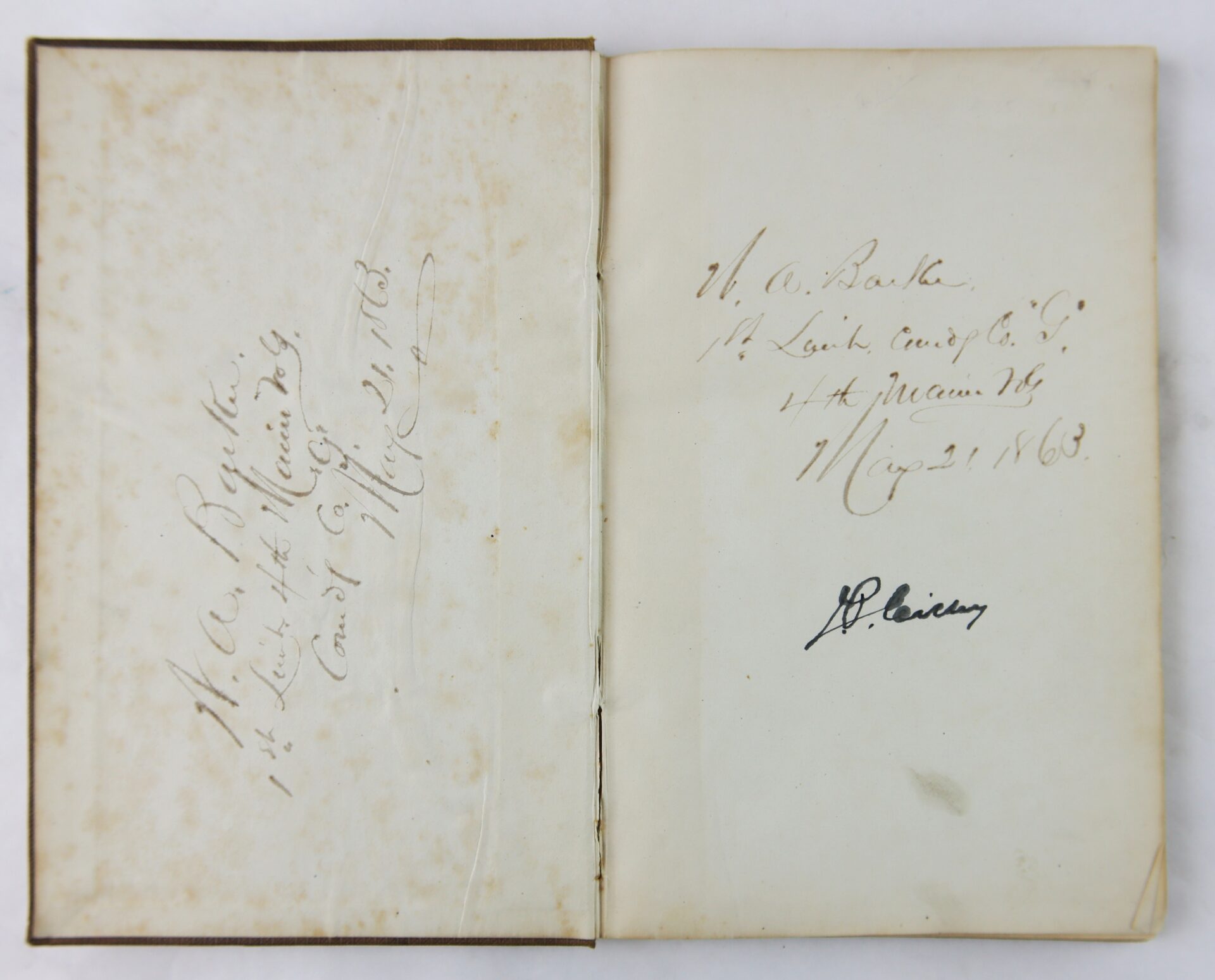 Two handwritten ink inscriptions in the 1863 Ordnance Bureau Manual, identified to William A. Barker of the 4th Maine Volunteer Infantry, dated May 21, 1863, St. Louis, and signed by J.P. Leisy.