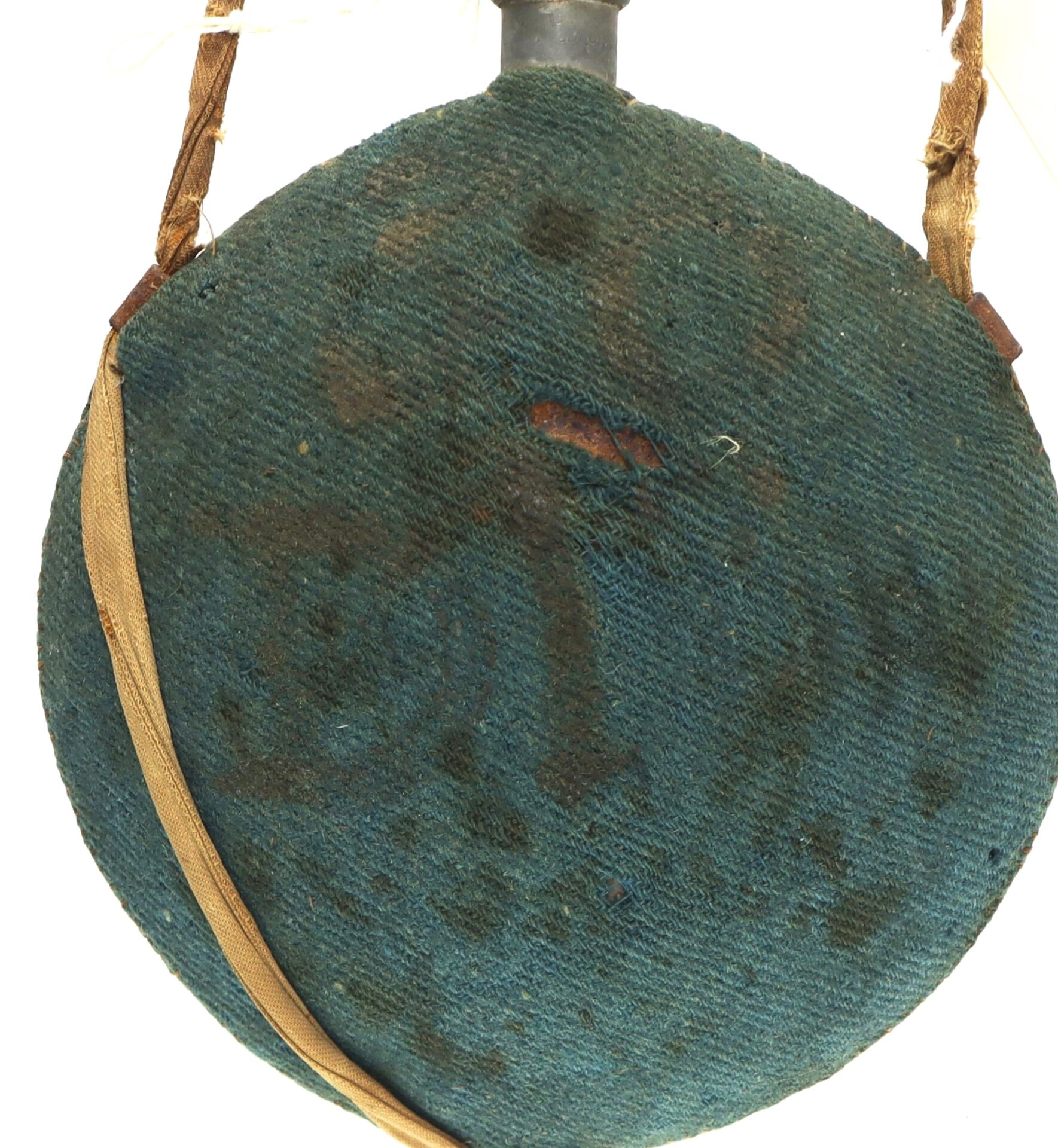 An Outstanding Identified Massachusetts Heavy Artillery Canteen belonging to Benjamin D. Reed (30th Unattached Co.) features a round, worn blue-green fabric cover with stains, a central tear, and an attached tan strap.