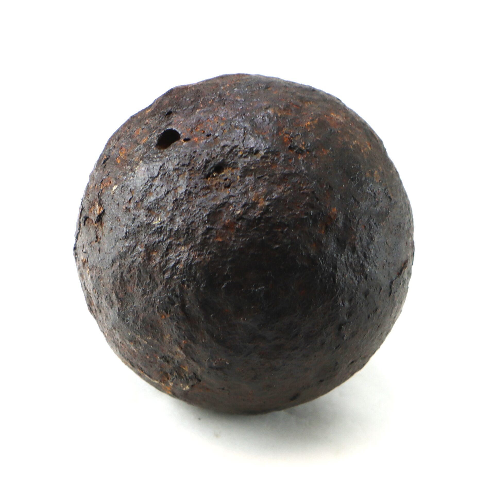 A Confederate Civil War 6-pounder solid shot cannonball recovered from Bull Run is displayed against a white background.