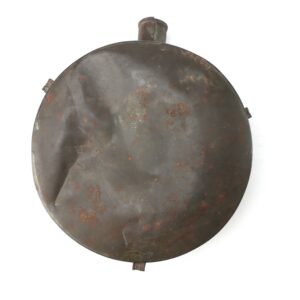 A round, dented and rusted metal canteen with a spout at the top, photographed against a white background.