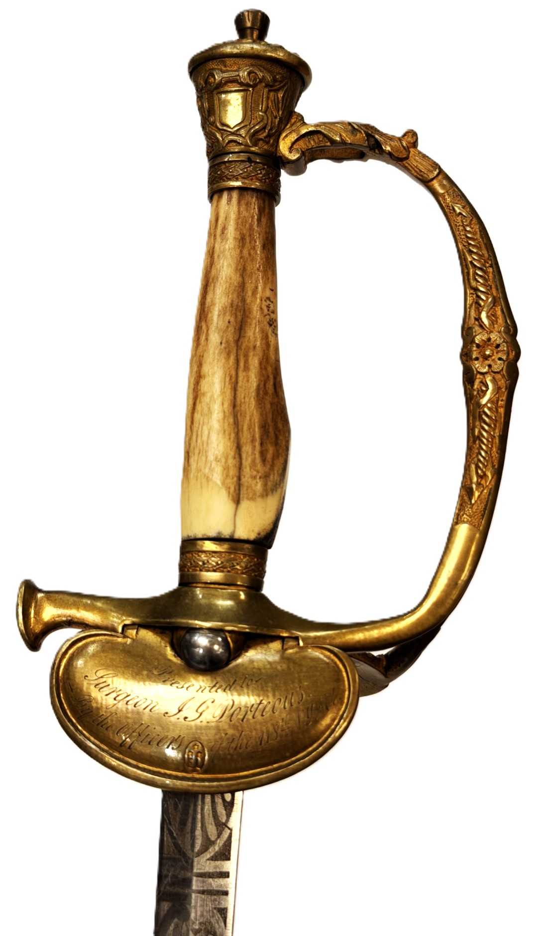 A ceremonial sword with a detailed brass guard, inscribed hilt, and a handle made of ivory or bone, displayed against a white background.