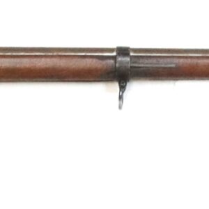 A vintage bolt-action rifle with a wooden stock and a fixed bayonet attached to the muzzle.