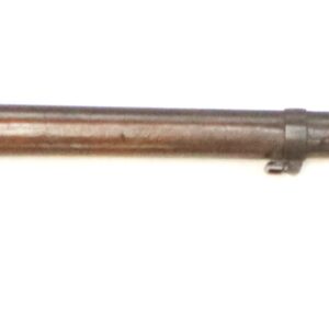 A vintage military rifle with a wooden stock and a long metal bayonet attached to the barrel.