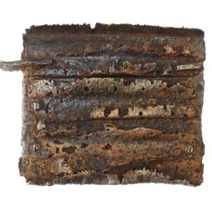 Heavily rusted and corroded rectangular metal object with bolts and flaking surface, set against a white background.