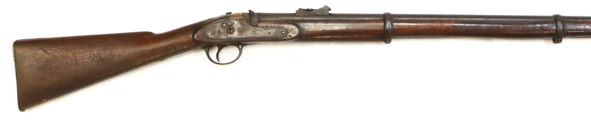 A vintage, wooden-stocked, single-barrel percussion cap rifle with metal fittings, two barrel bands, and an iron trigger guard.