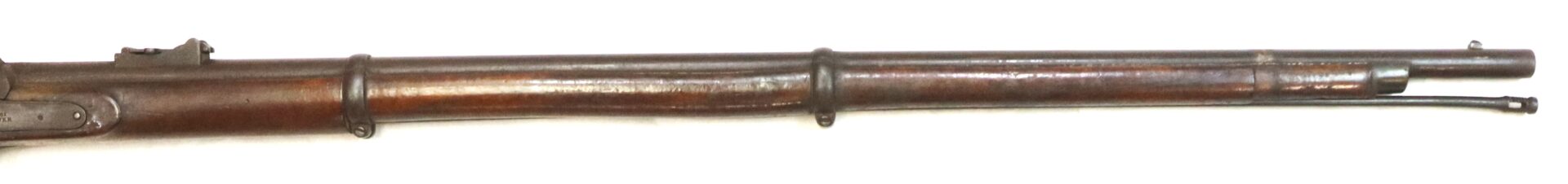 Close-up view of the barrel and front half of an antique wooden-stock rifle, showing metal bands and cleaning rod underneath.