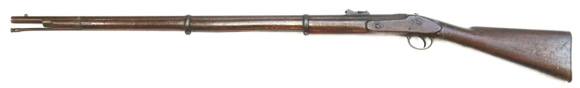 Antique lever-action rifle with a wooden stock and metal barrel, shown in profile against a white background.
