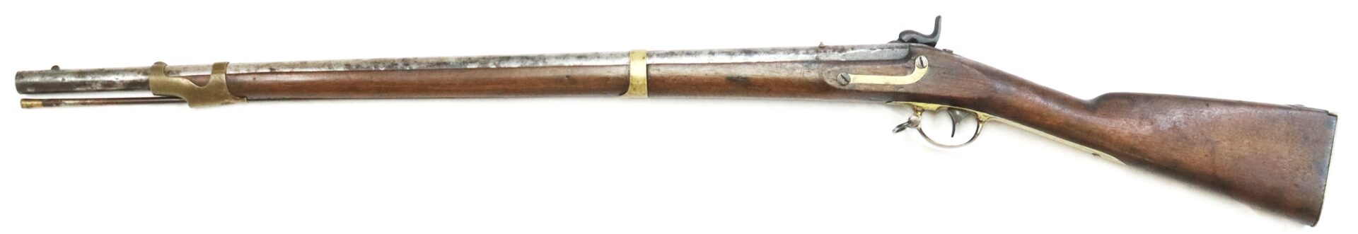 Side view of an antique, muzzle-loading flintlock rifle with a wooden stock and metal barrel, photographed on a white background.