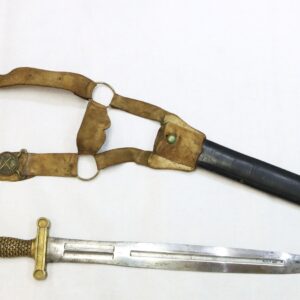 A ceremonial dagger with a decorative hilt and a scabbard, shown alongside its leather belt and strap on a plain white background.