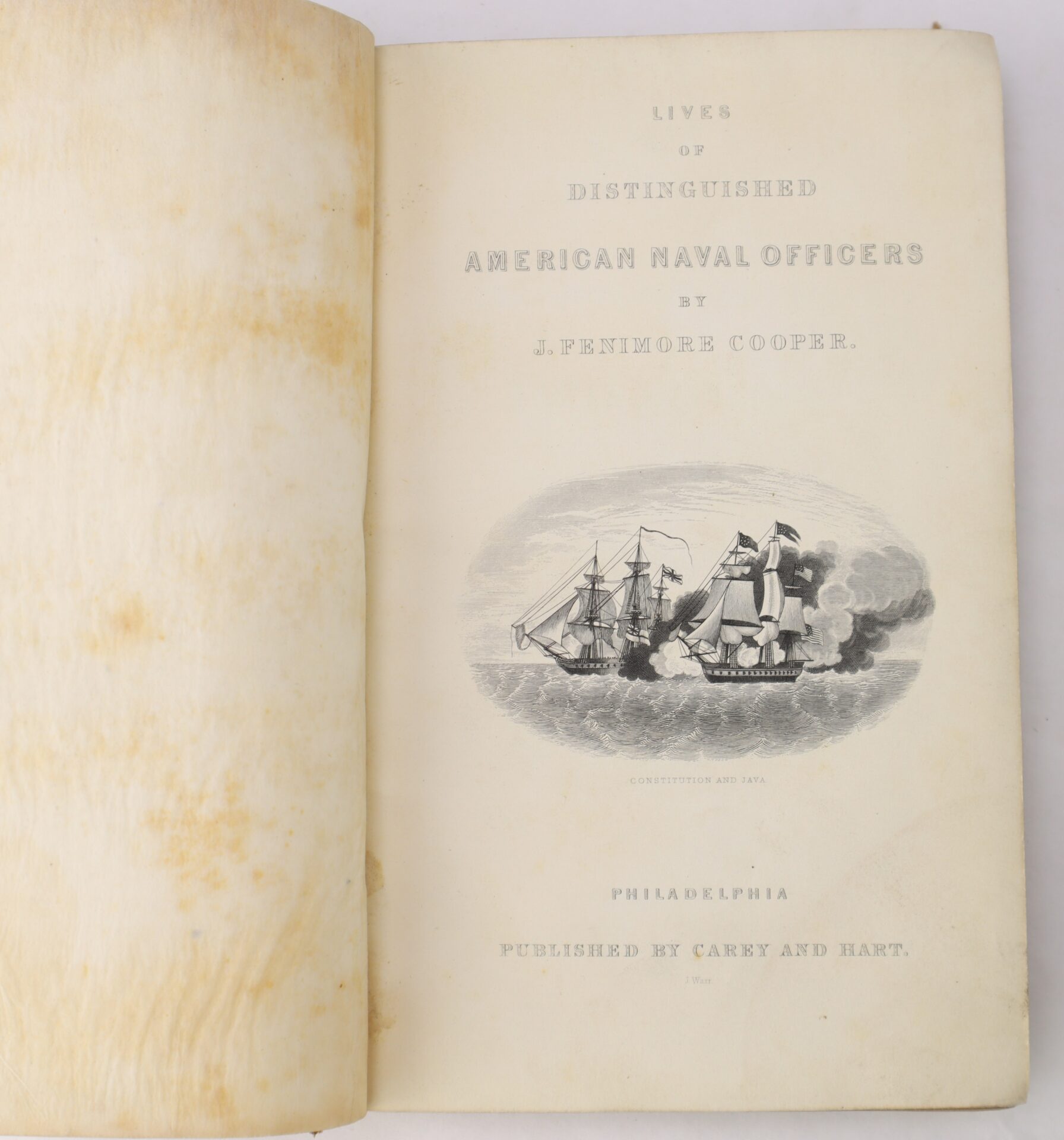 Open book showing the title page of "Lives of Distinguished American Naval Officers" by J. Fenimore Cooper, with an illustration of two ships in battle and publication details below.