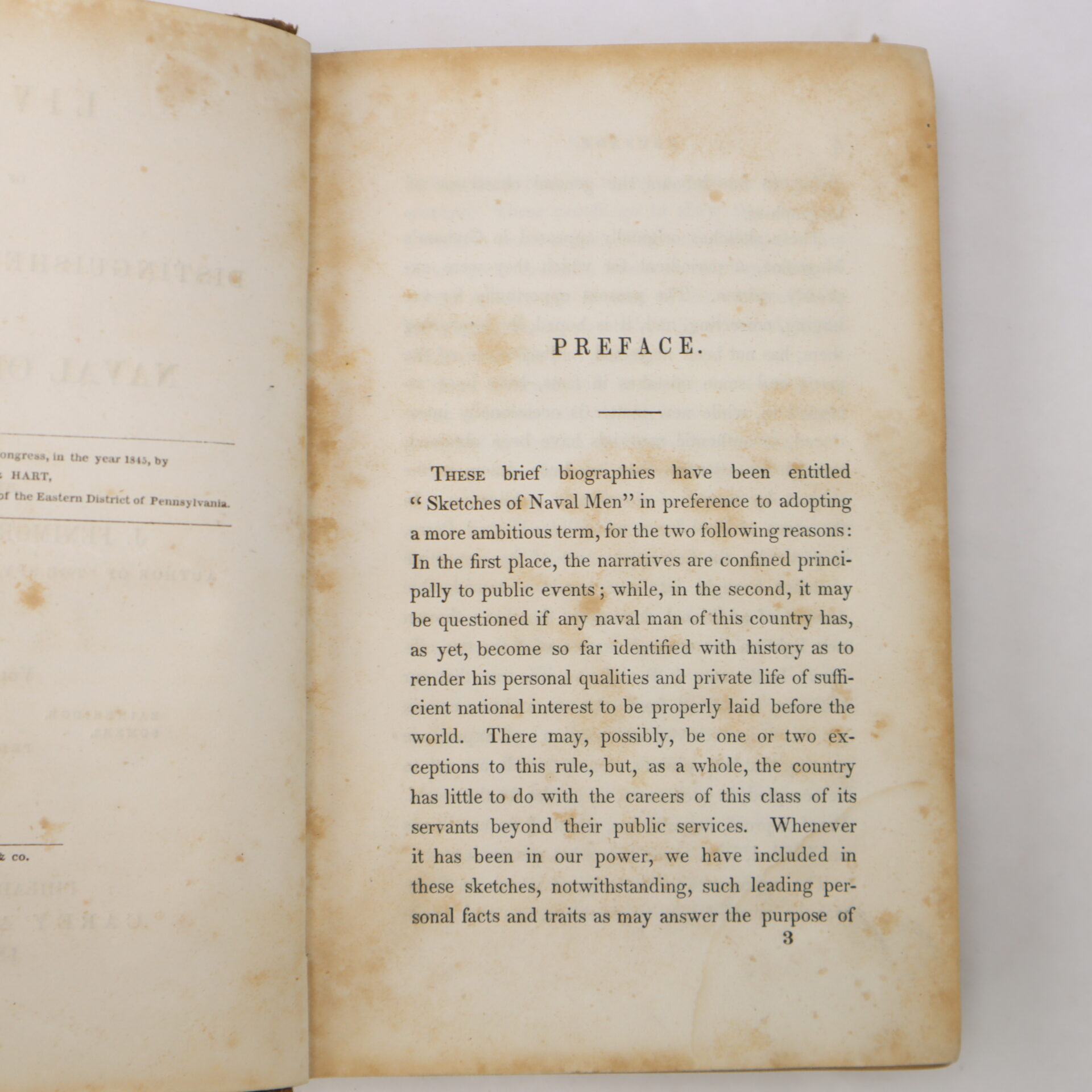Open book displaying a preface page titled "PREFACE," with printed text explaining the focus and approach of the included biographies. The page shows some age spots and yellowing.