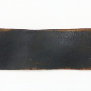 A worn, wide black leather strap with a brass buckle on one end and a metal clip on the other, laid flat on a white background.