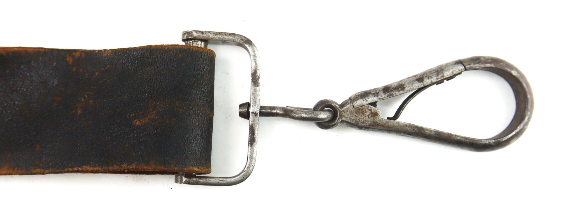 Close-up of a worn leather strap attached to a metal buckle and a weathered metal swivel snap hook, shown against a white background.