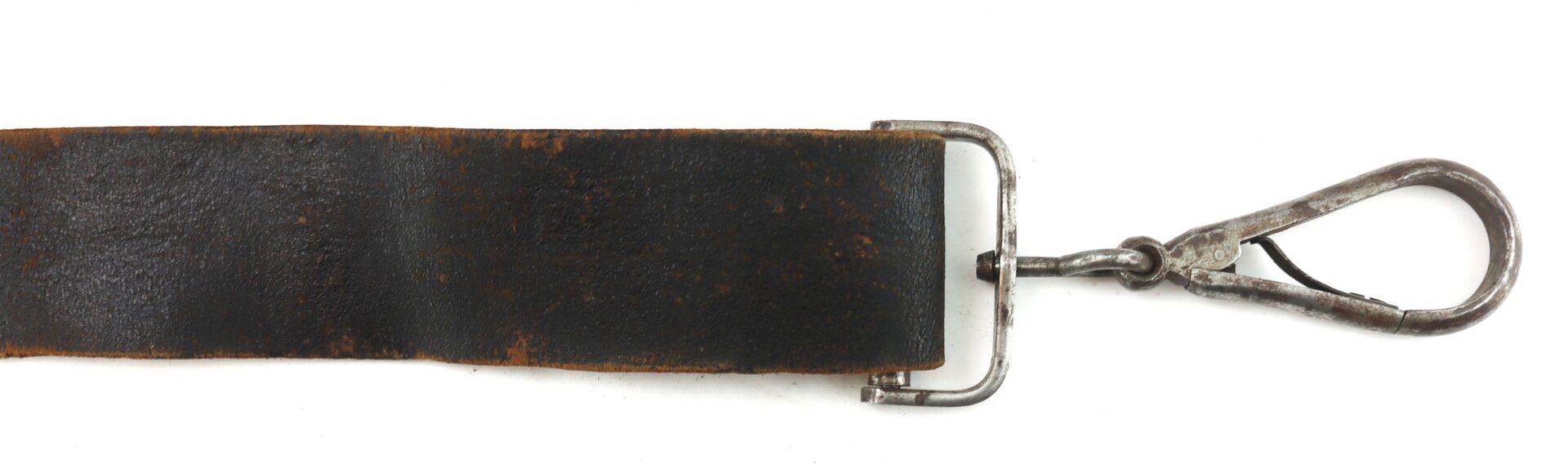 A worn black leather strap with a rusty metal buckle and an attached metal clasp on a white background.