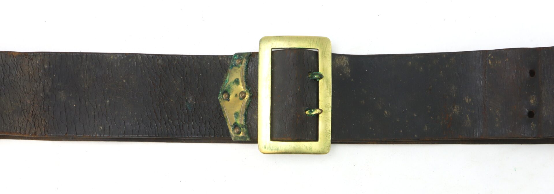 A worn Cavalry Carbine Sling featuring dark leather, a rectangular brass buckle, and visible green corrosion near the buckle area.