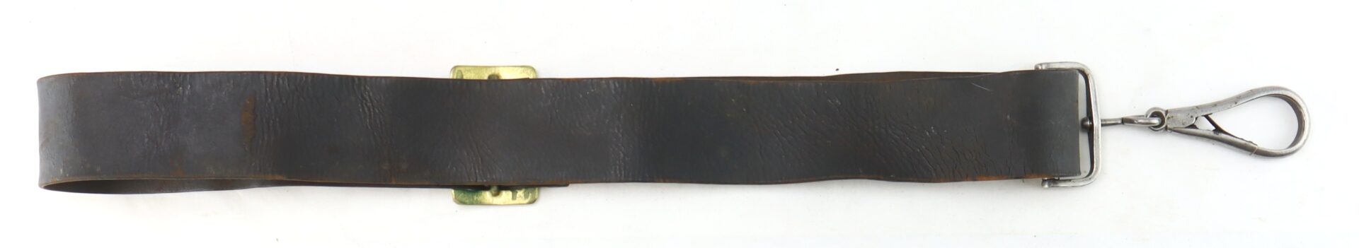 The Cavalry Carbine Sling features a wide, dark leather strap with a brass buckle and a metal clip at one end, displayed flat on a white background.