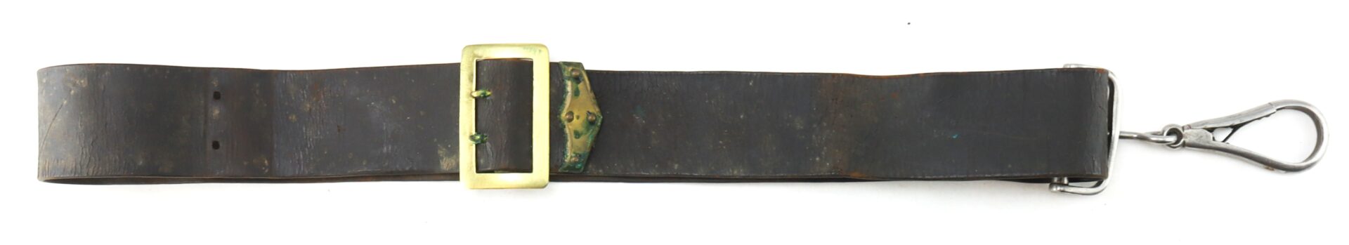 The Cavalry Carbine Sling features a worn black leather strap with a brass buckle and a metal snap hook at one end, shown laid flat on a white background.