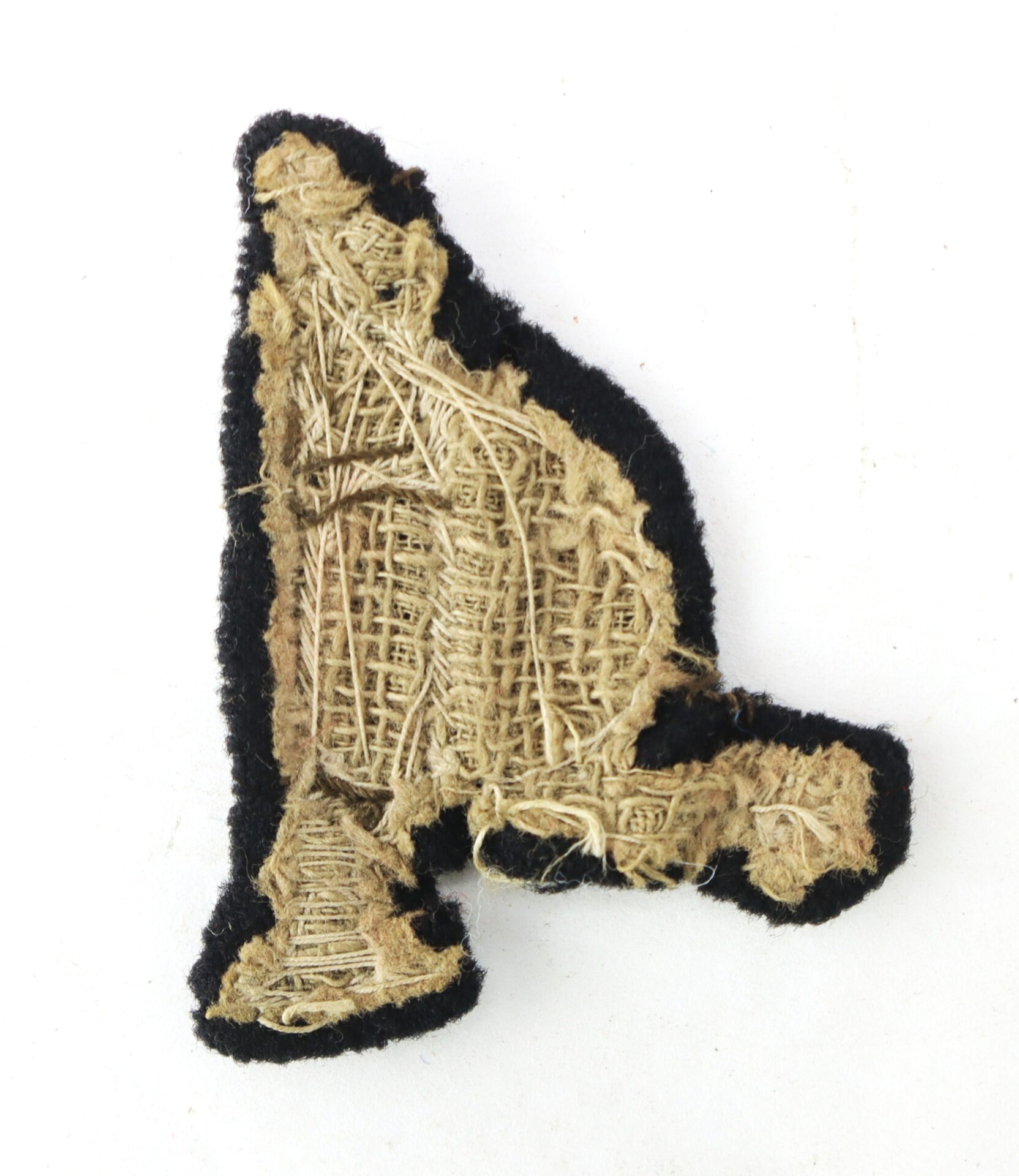 An Officer’s “Rifleman” Insignia patch, shaped like the letter "A," shown from the back with visible stitching and a black border.