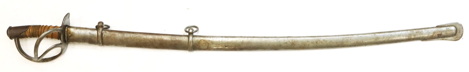 A vintage cavalry sword with a curved blade, metal handguard, and scabbard, featuring two suspension rings and a wrapped handle.