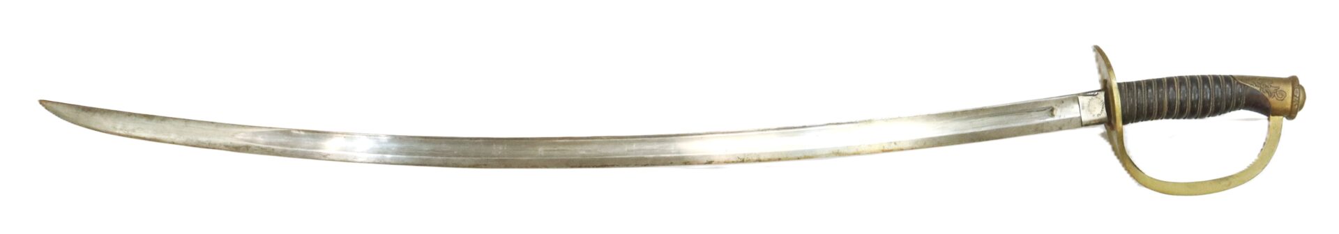 A curved, single-edged sword with a brass handguard and a dark, ribbed handle, shown against a white background.