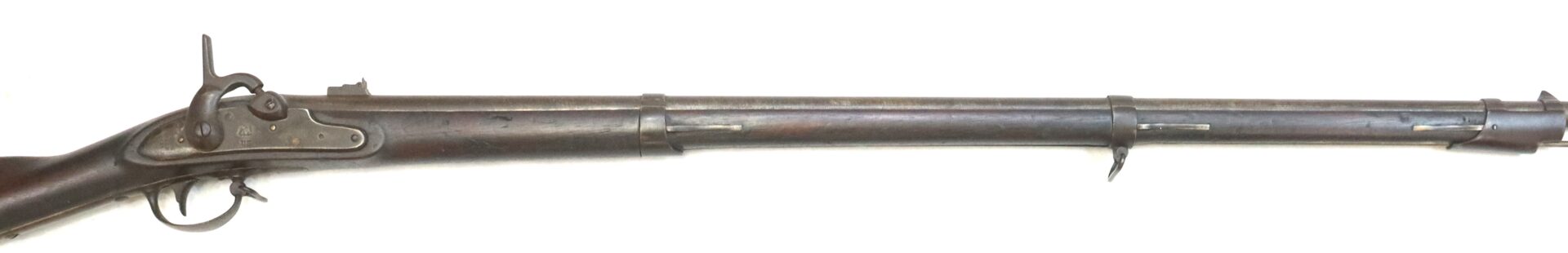 Side view of an antique, single-barrel rifle with a wooden stock, metal barrel, and iron sights, photographed on a white background.