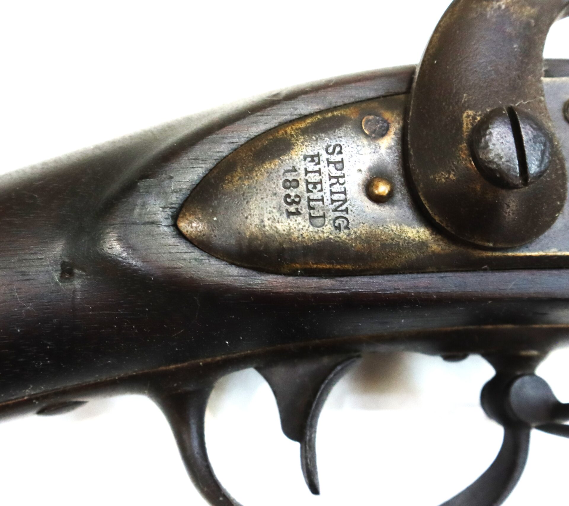 Close-up of the lock mechanism on an antique firearm, marked "SPRINGFIELD 1831" in engraved text on the metal plate.