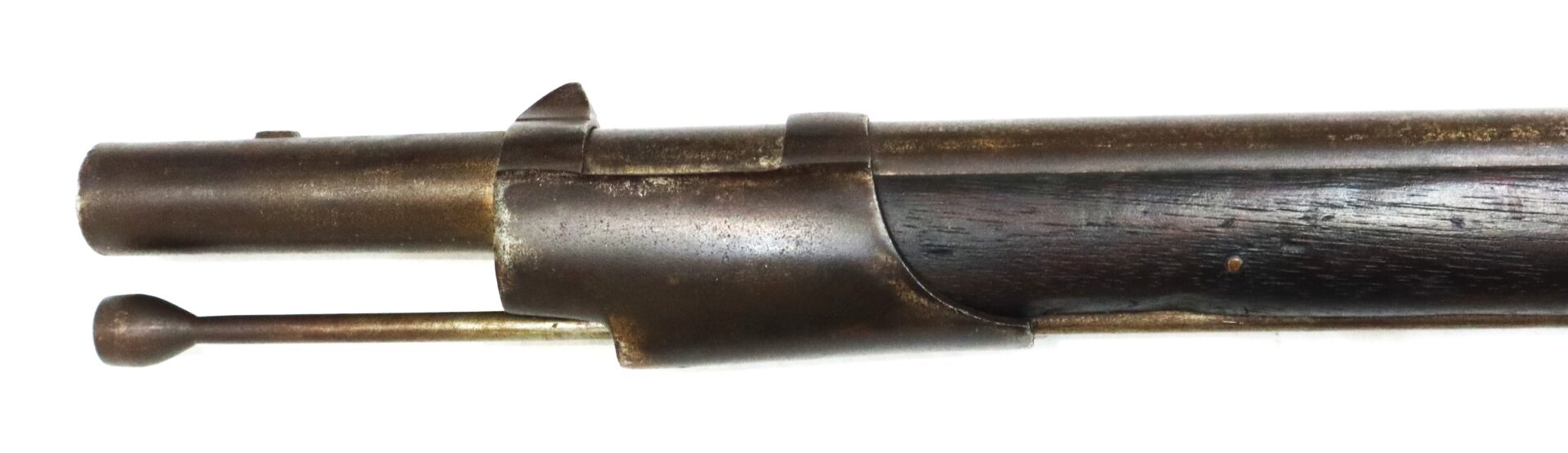 Close-up view of the bolt and receiver of an old, worn bolt-action rifle with a wooden stock.