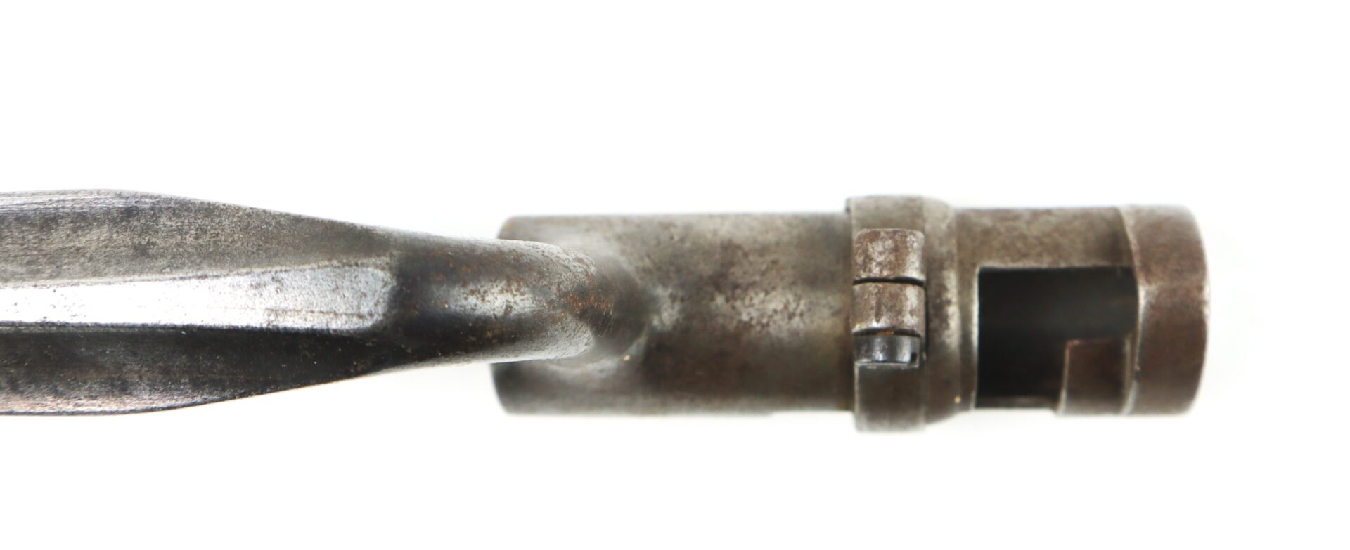 Close-up view of the Model 1855 .58 Caliber Triangular Socket Bayonet, featuring a cylindrical end and grooved handle, photographed against a white background.